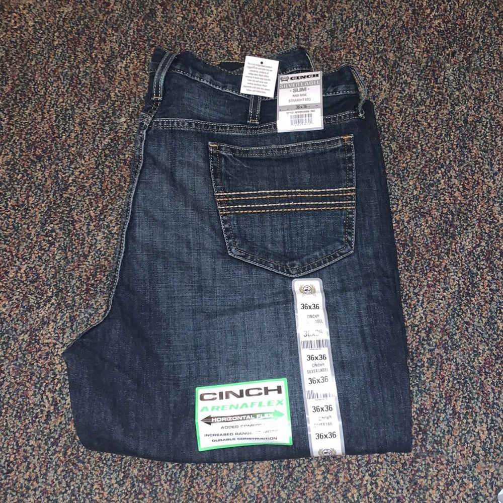 I have two pairs of Cinch mid rise straight leg denim jeans both size 36x36.